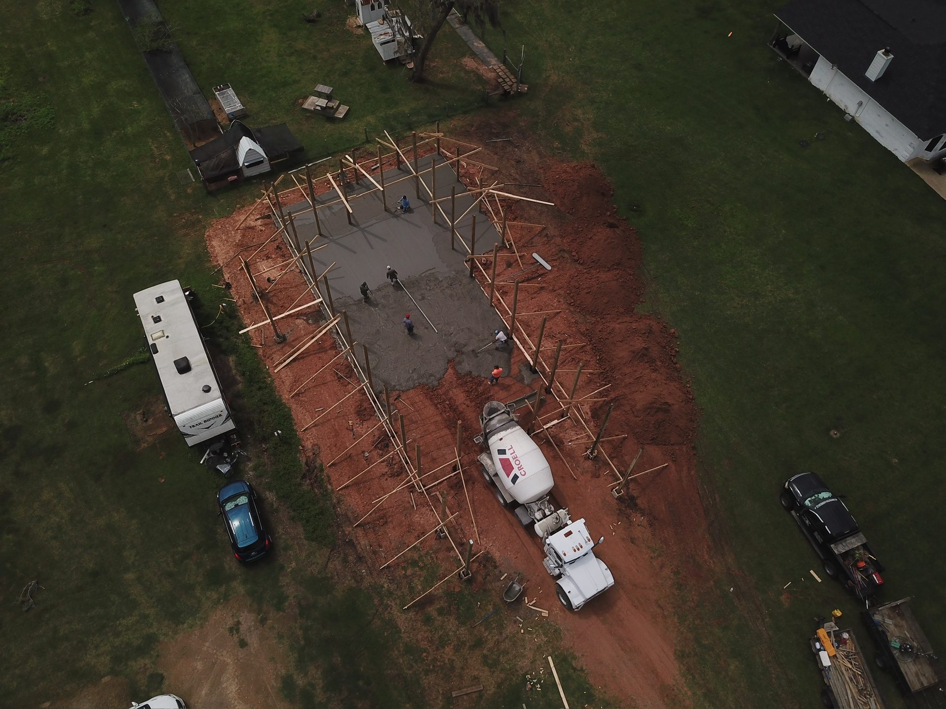 Aerial view of a concrete slab pour with ready-mix truck on site