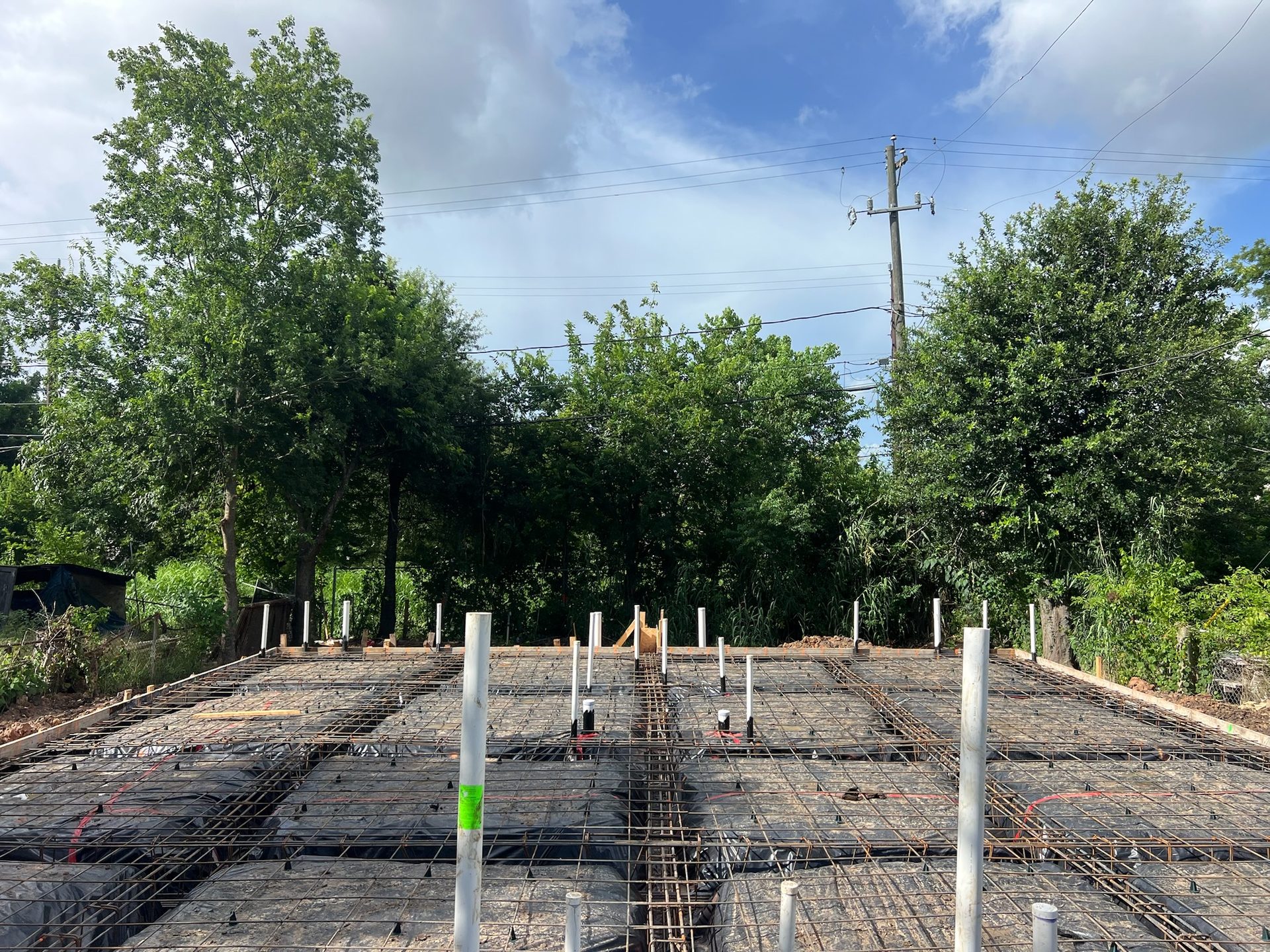 Reinforced rebar grid staged for a foundation pour