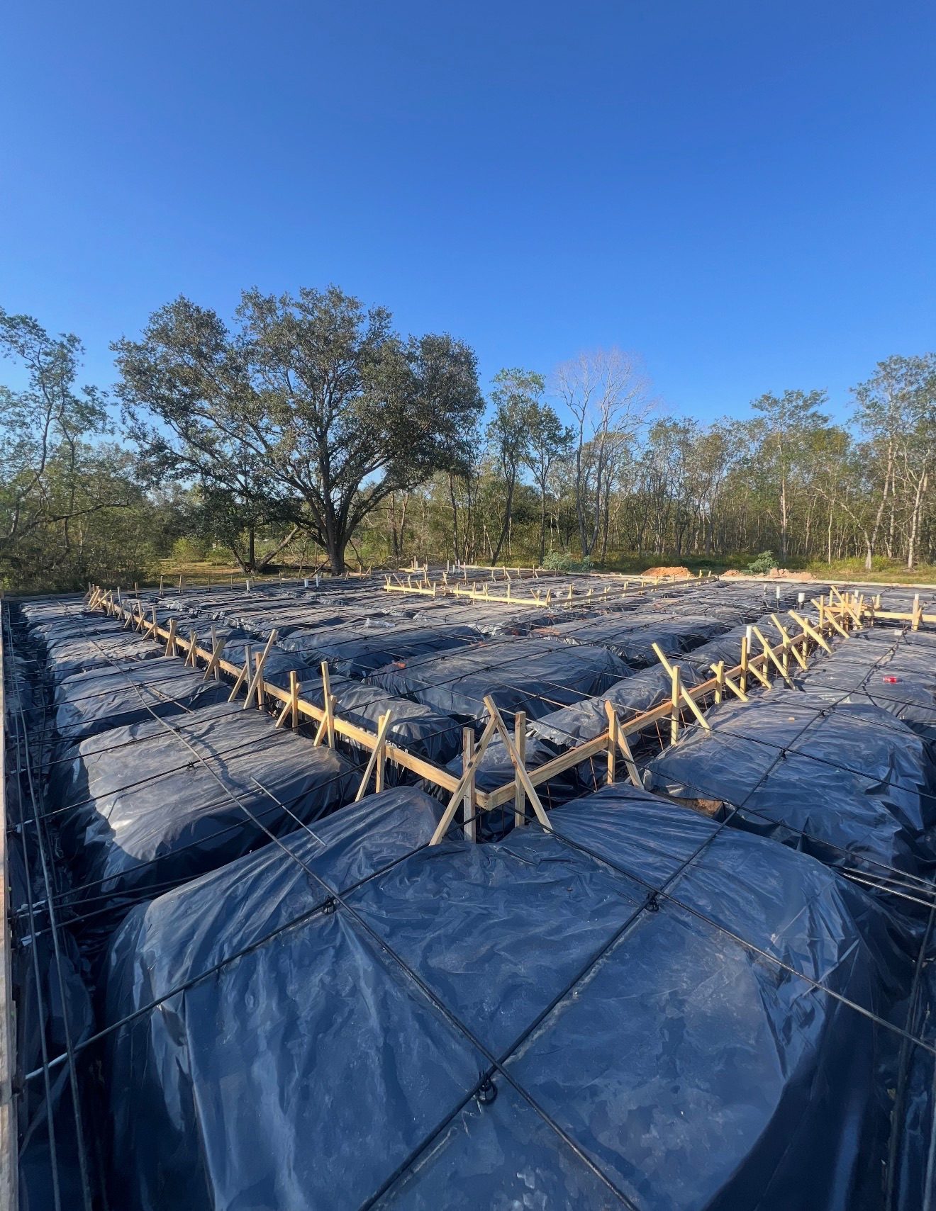 Rebar and vapor barrier prepped for a large foundation pour